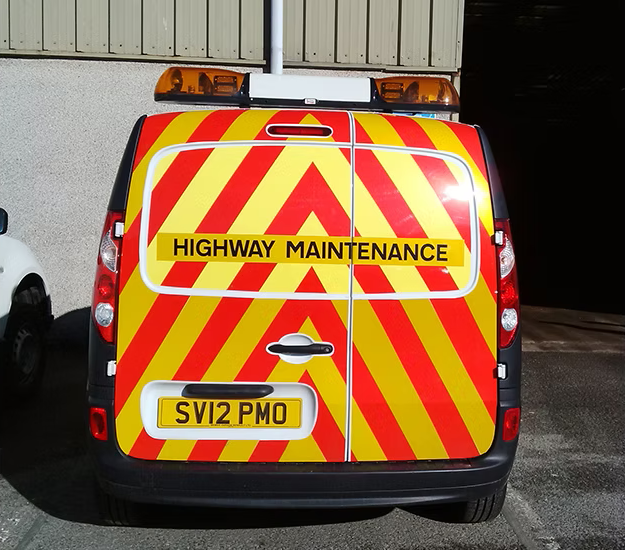 Reflective vehicle livery on commercial van